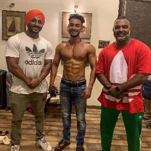 Aayush Sharma with his trainer Rajendra Dhole on right